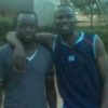 Lutwama (right) and Kassim Ssentongo on the basketball court. PHOTO BY ISAAC SSEJJOMBWE